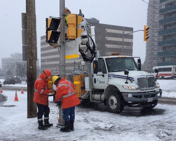 Three city technicians installing Key2Access in Ottawa in the middle of winter. This was the first ever Key2Access installation!