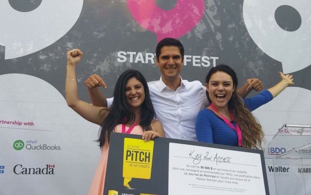 Sophie and Sarah posing with Harout Chitilian, former Montreal City councillor, after winning the pitch contest at Start-Up fest and being awarded $30 000 in advertising services and free office space at Notman House, courtesy of Videotron.